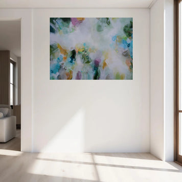 Abstract painting on a wall in a bright living room