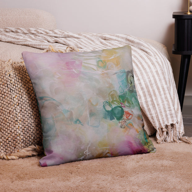 Decorative pillow with watercolor design on a couch
