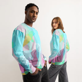 Two people wearing colorful tie-dye sweatshirts against a plain background