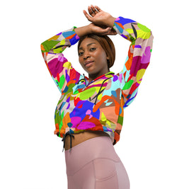 Person wearing a colorful abstract patterned hoodie on a white background