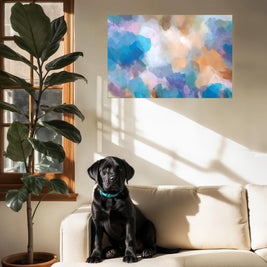 Black dog sitting on a beige couch with a colorful abstract painting on the wall and a potted plant next to a window.