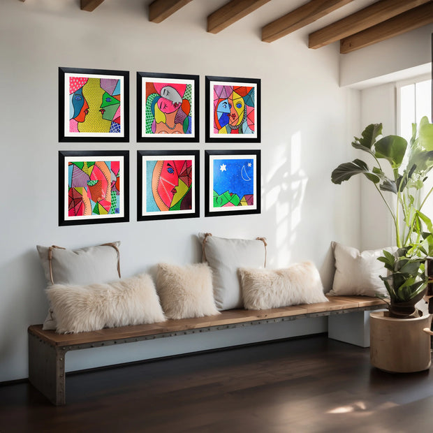 Six framed abstract pop-art prints in a 2x3 grid are displayed on a white wall above a wooden bench with cream pillows in a modern living room setting.