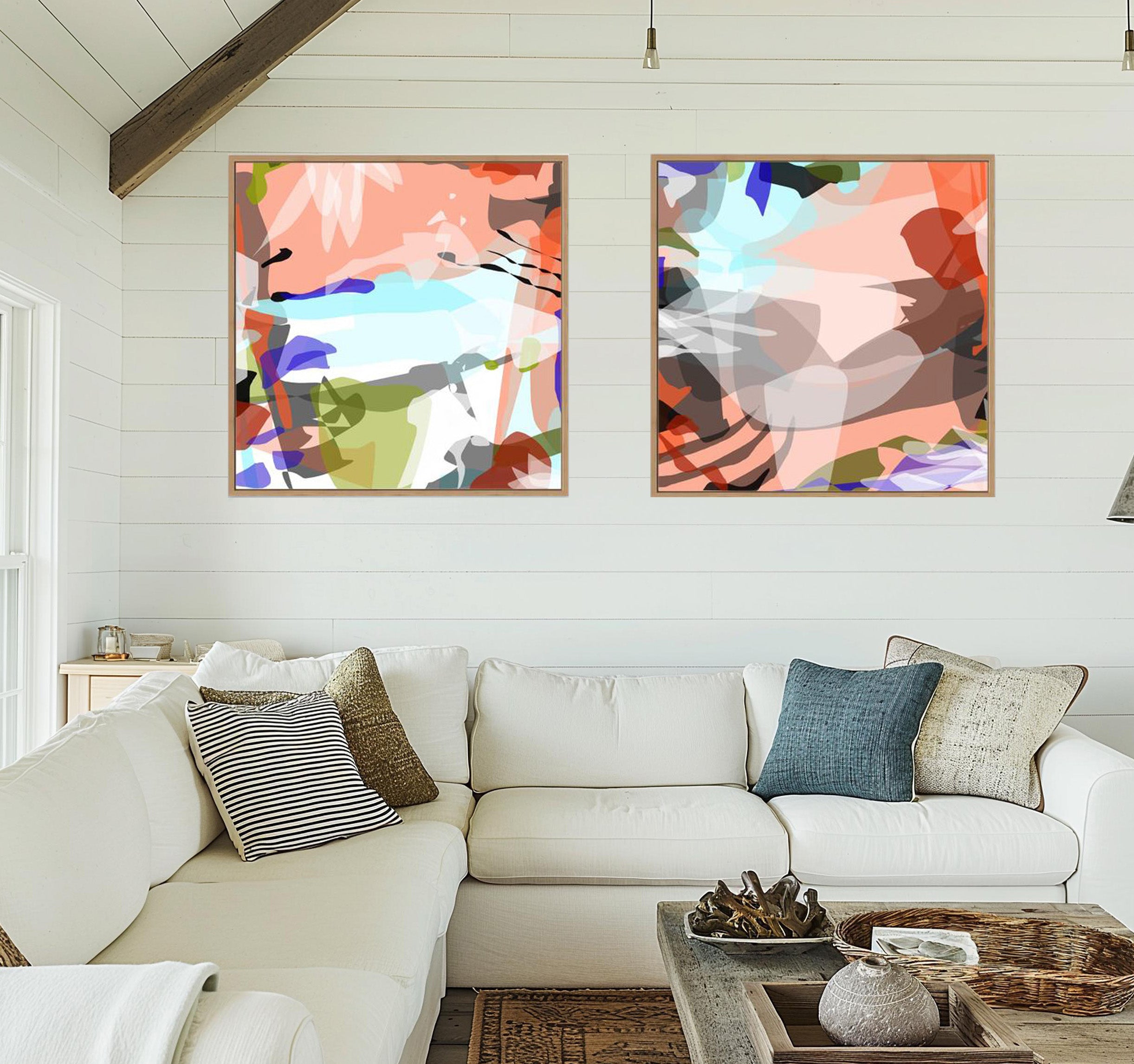 Living room with a white sofa, abstract art on the wall, and decorative items.