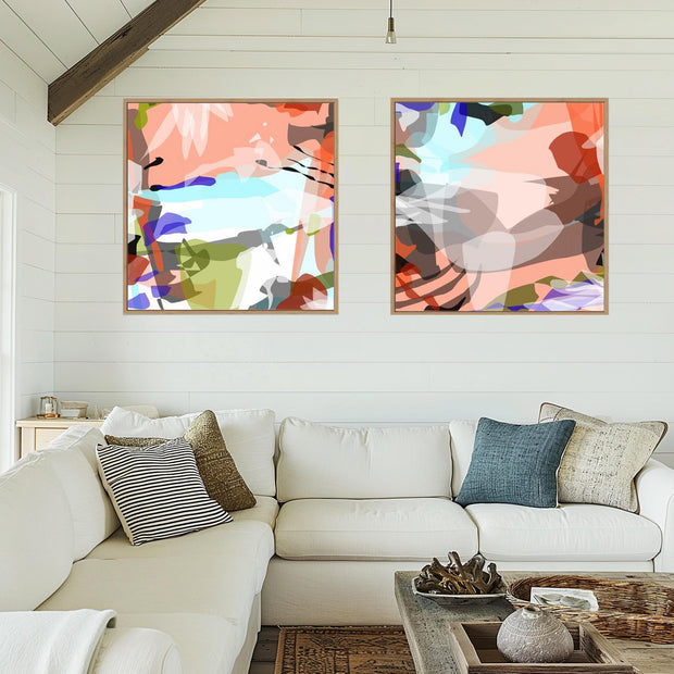 Living room with a white sofa, abstract art on the wall, and decorative items.