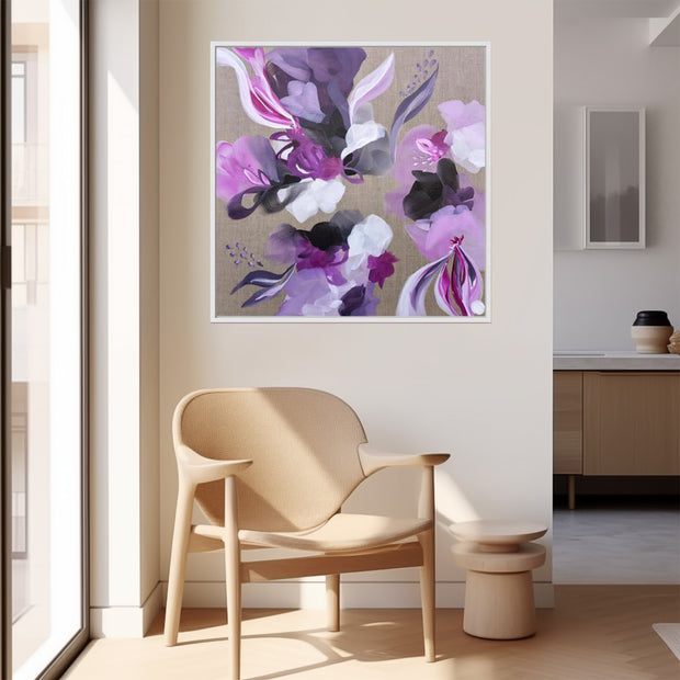 Floral inspired pink, mauve grey and white painting on wall above chair