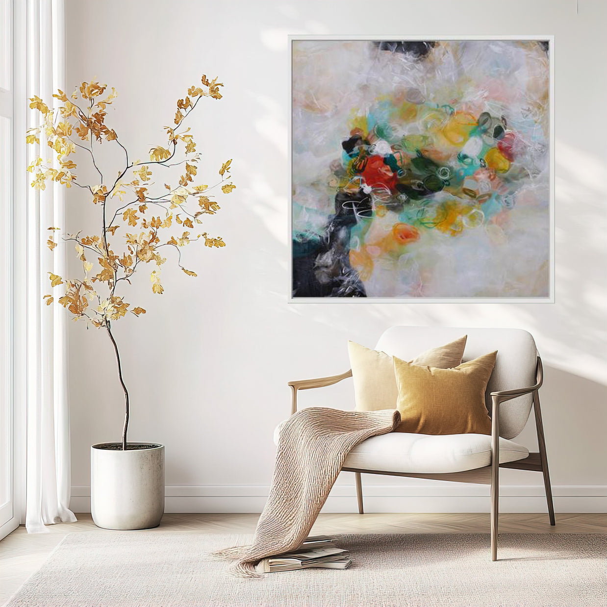 Modern living room with a white armchair, abstract painting, and decorative plant.