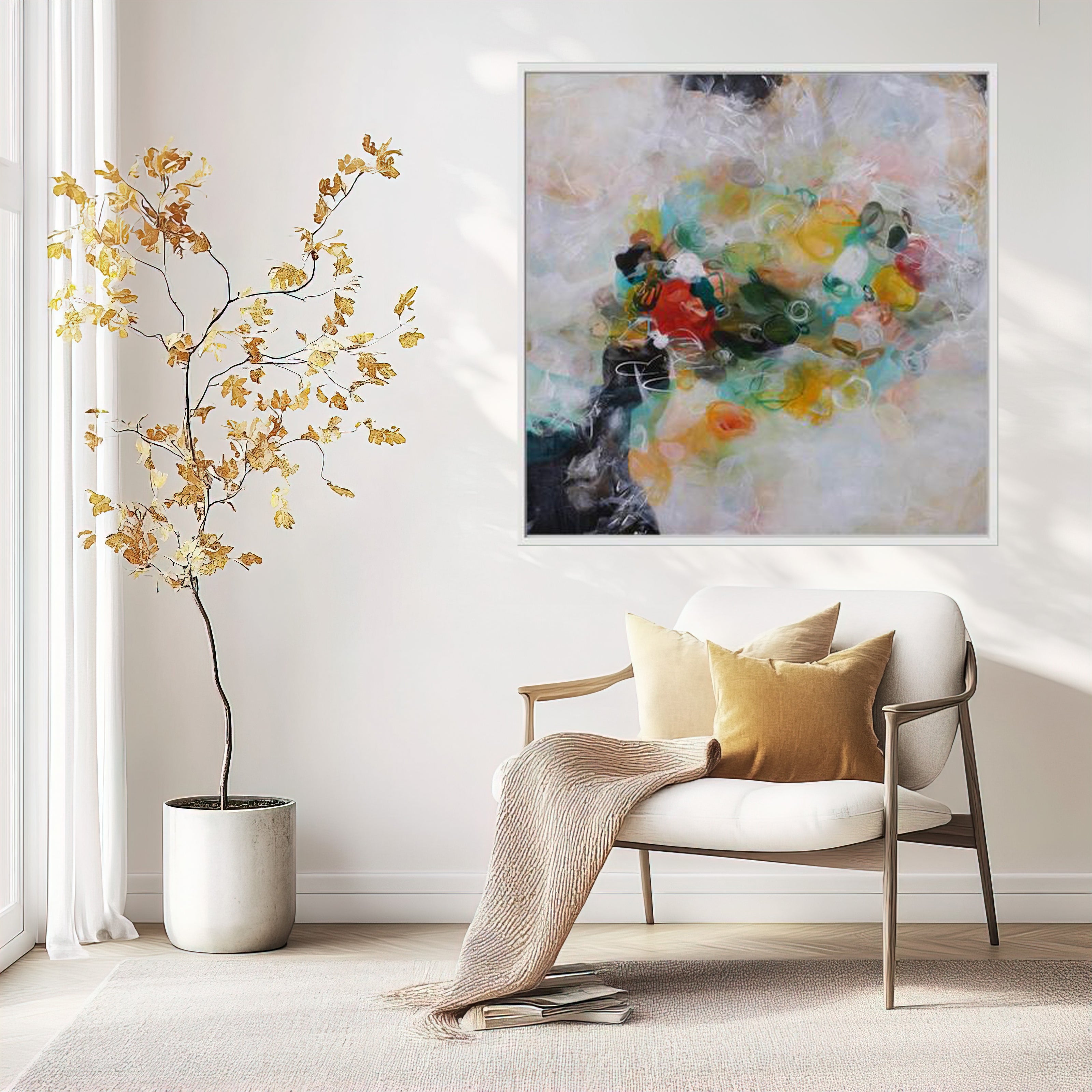 Modern living room with a white armchair, abstract painting, and decorative plant.