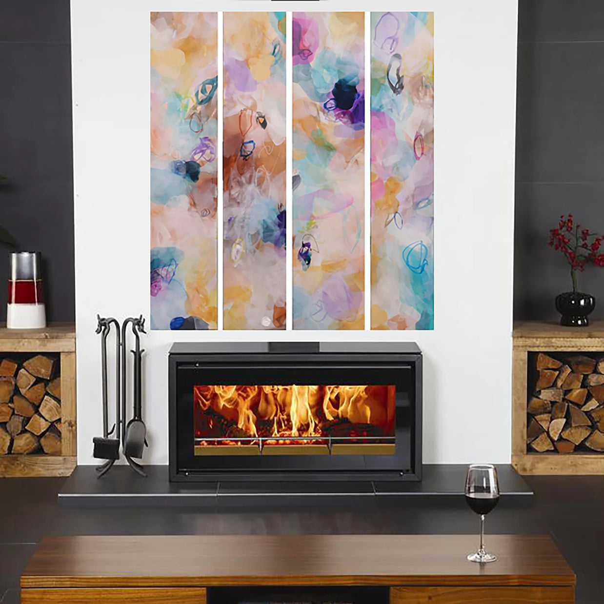 Modern fireplace with colorful abstract art above it in a living room setting.