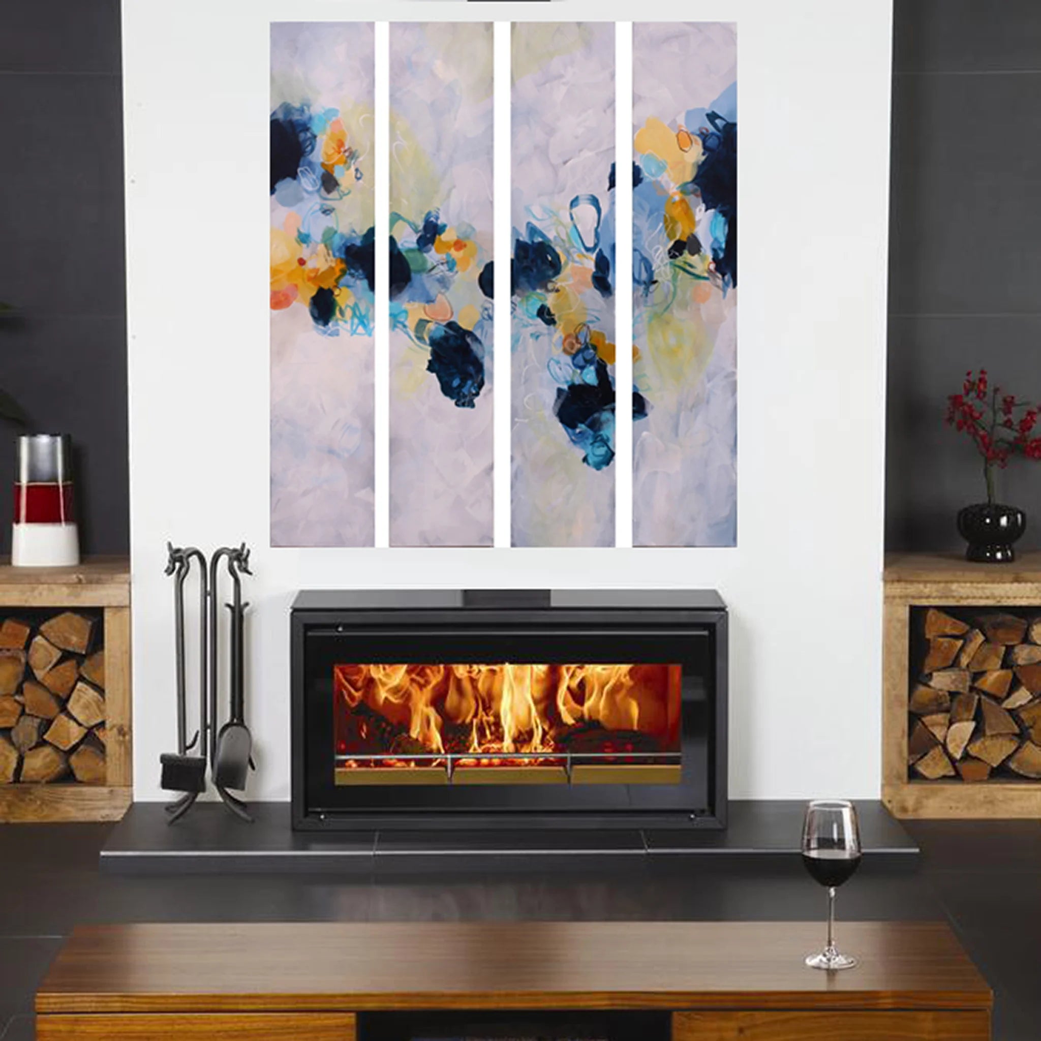 Colourful blue yellow white and greay four panel abstract painting above fire