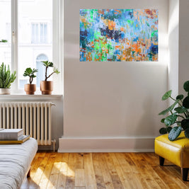 Living room with a colorful abstract painting on the wall, plants, and a yellow chair.