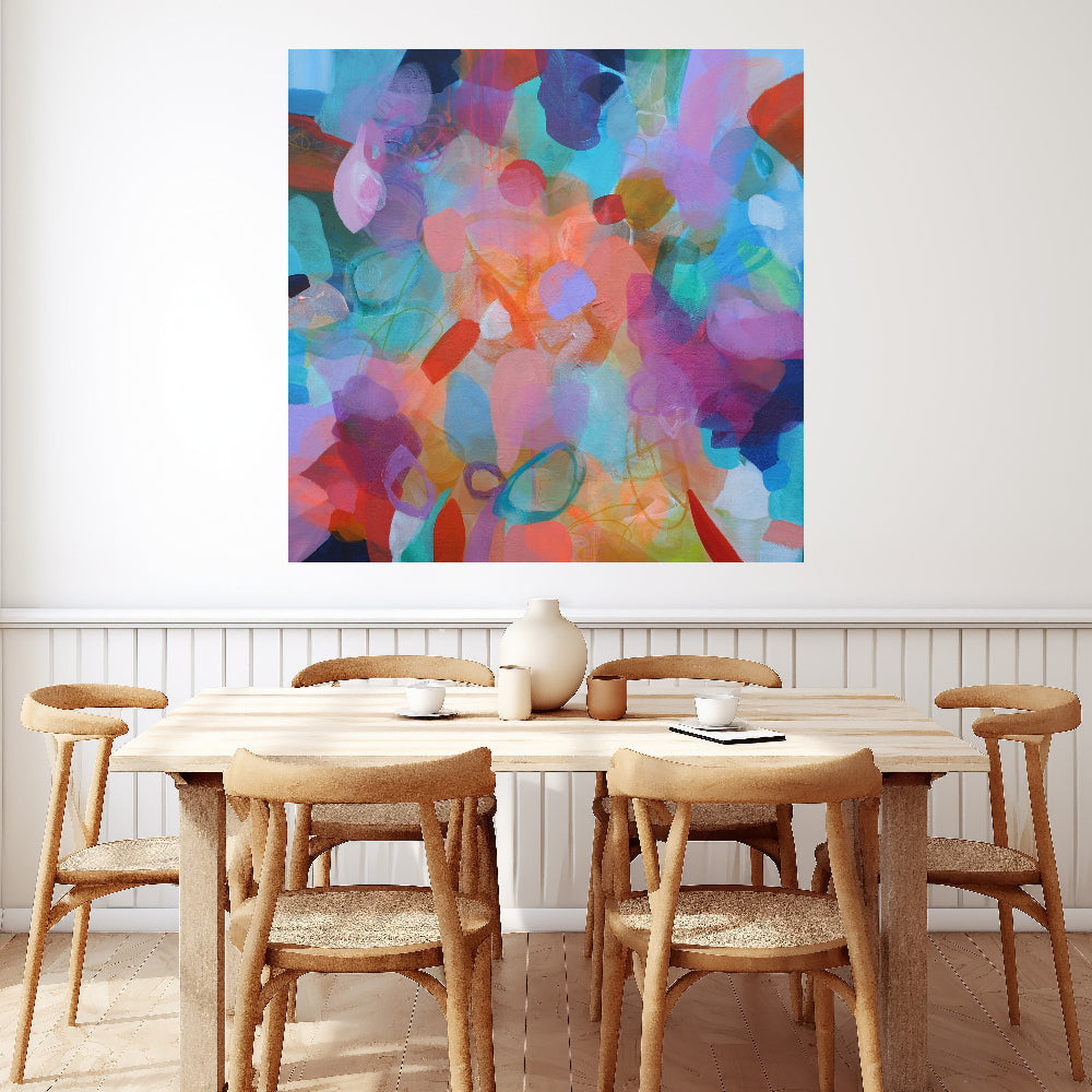 Dining room with a wooden table and chairs, colorful abstract painting on the wall.