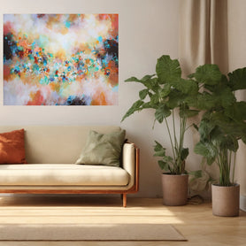 Living room with a beige sofa, colorful abstract painting, and potted plants.