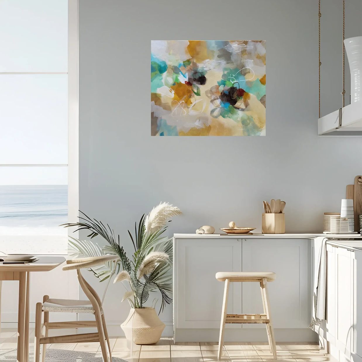 Colorful abstract painting on a wall above a kitchen counter with decor items.