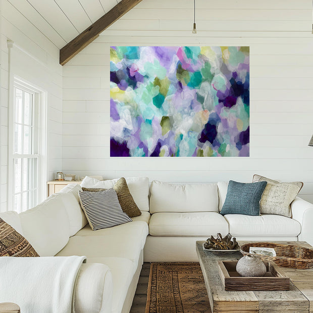 Living room with a white sofa, colorful abstract painting on the wall, and wooden coffee table.