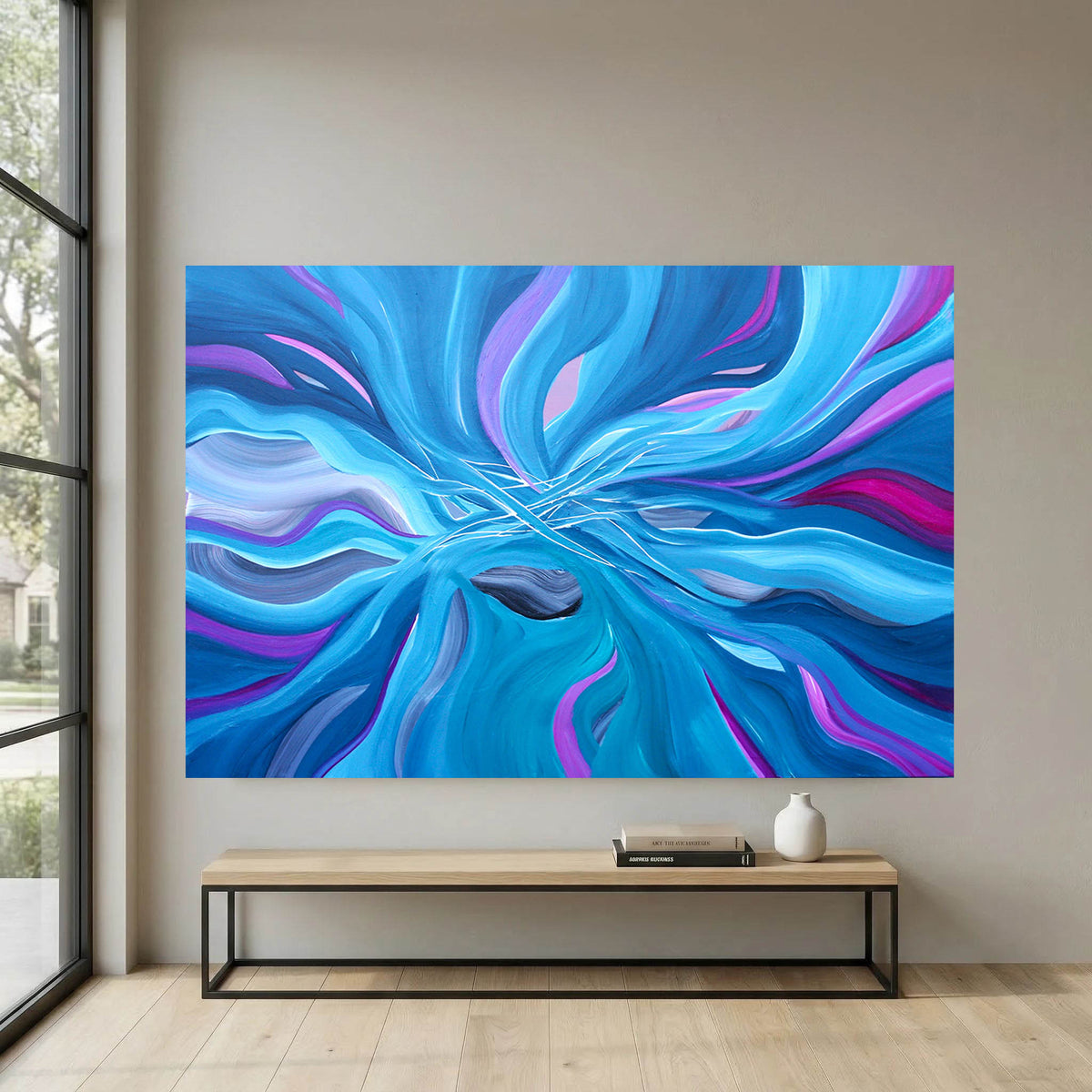 Abstract wall art featuring swirling blue, cyan, purple, and magenta paint-like waves, displayed above a light wood bench in a modern interior with a window and pale wall.