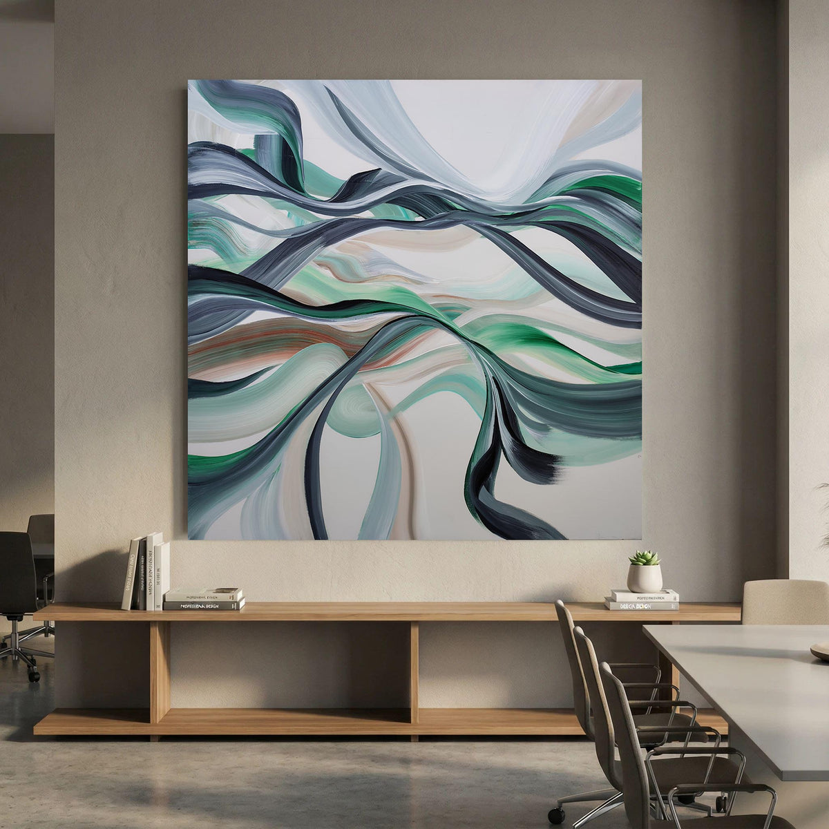 Large abstract canvas wall art with flowing ribbon-like bands in teal, green, navy, gray, and white, displayed above a wooden console in a modern office interior.