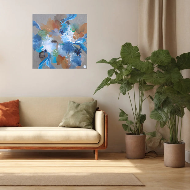 Living room with a beige sofa, decorative pillows, and a colorful abstract painting on the wall.