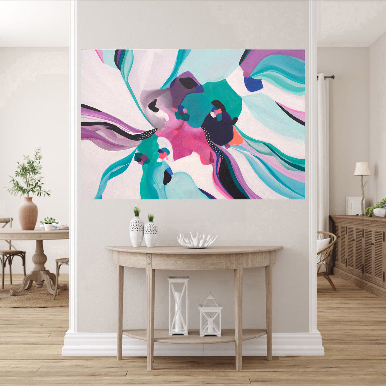 Modern living room with a colorful abstract painting on the wall.