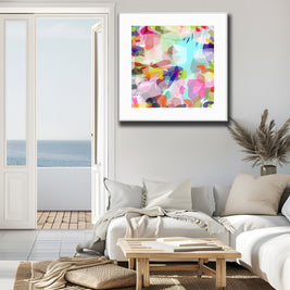 Living room with a colorful abstract painting on the wall, a sofa, and a coffee table.