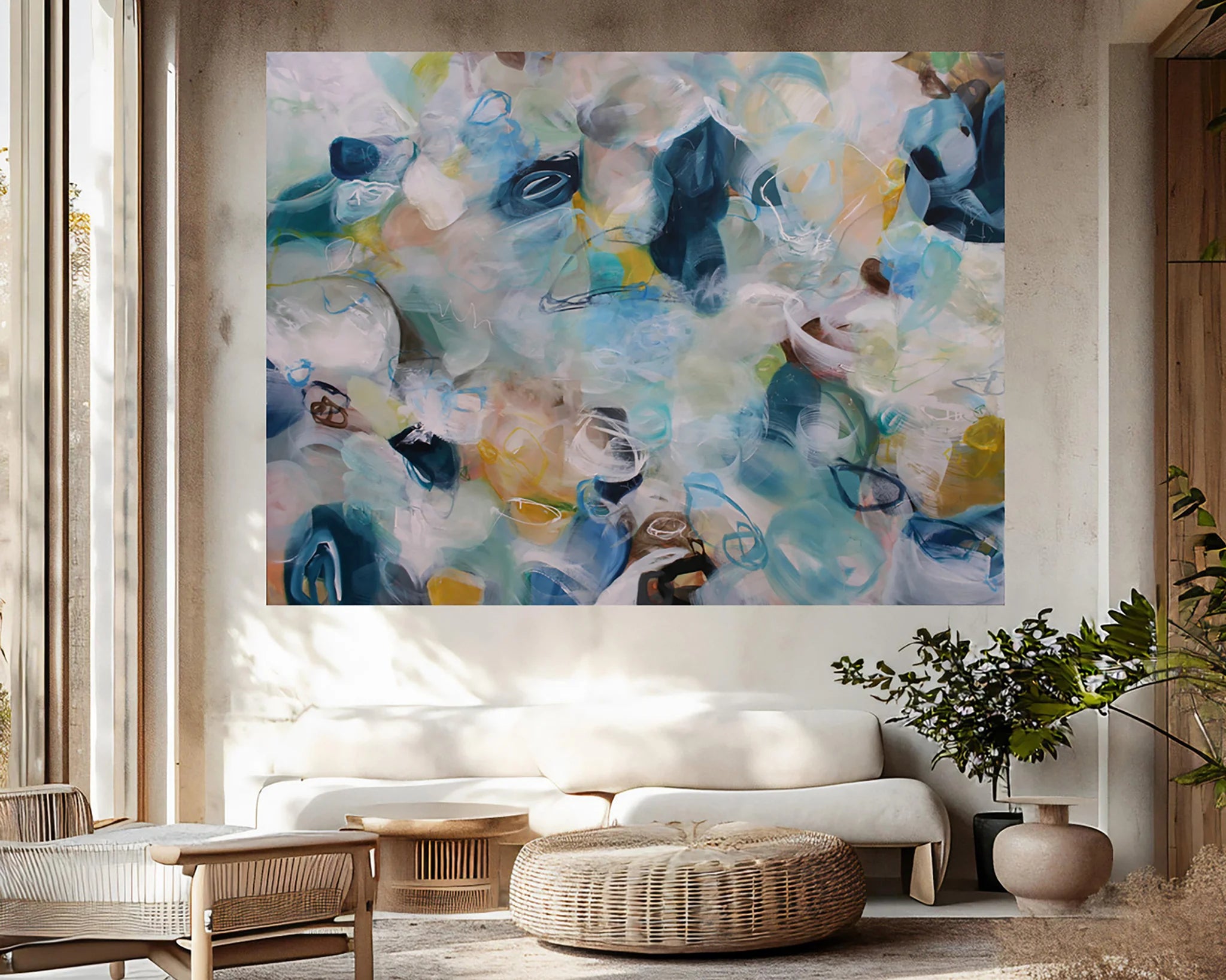 Abstract painting in a living room with a sofa and decor