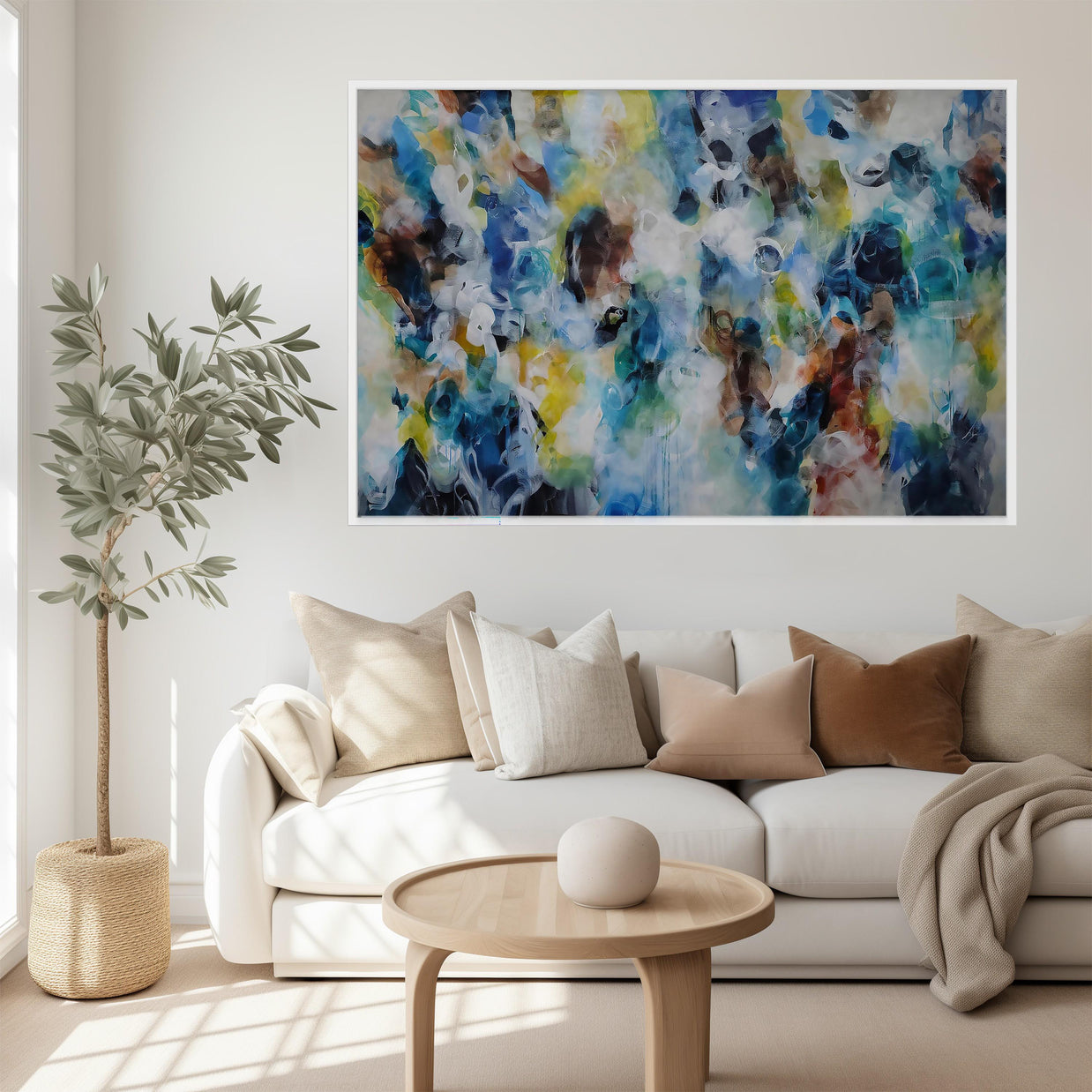 Modern living room with a white sofa, coffee table, and abstract painting on the wall.