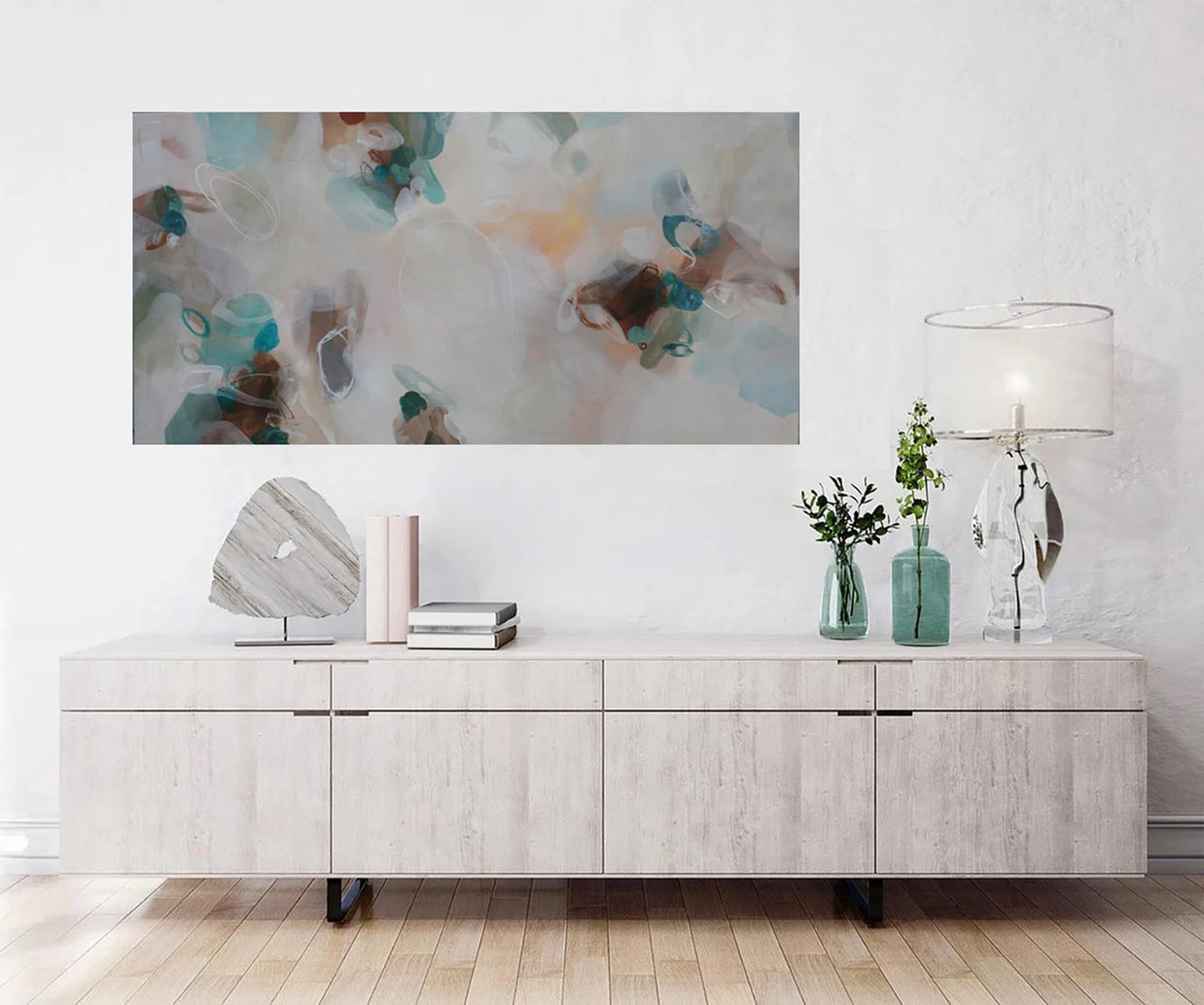 Modern living room with a large abstract painting above a wooden console table.