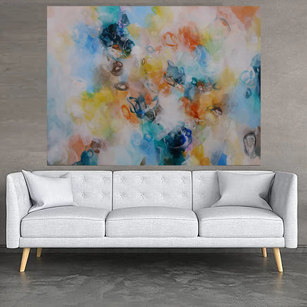 Modern living room with a white sofa, colorful abstract painting, and small tables.