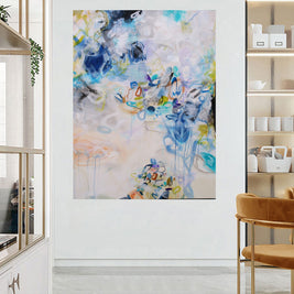 Abstract art painting in a modern interior setting with a chair and shelves.