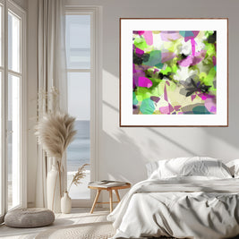 Colorful abstract art print on a wall in a bedroom with a bed and window.