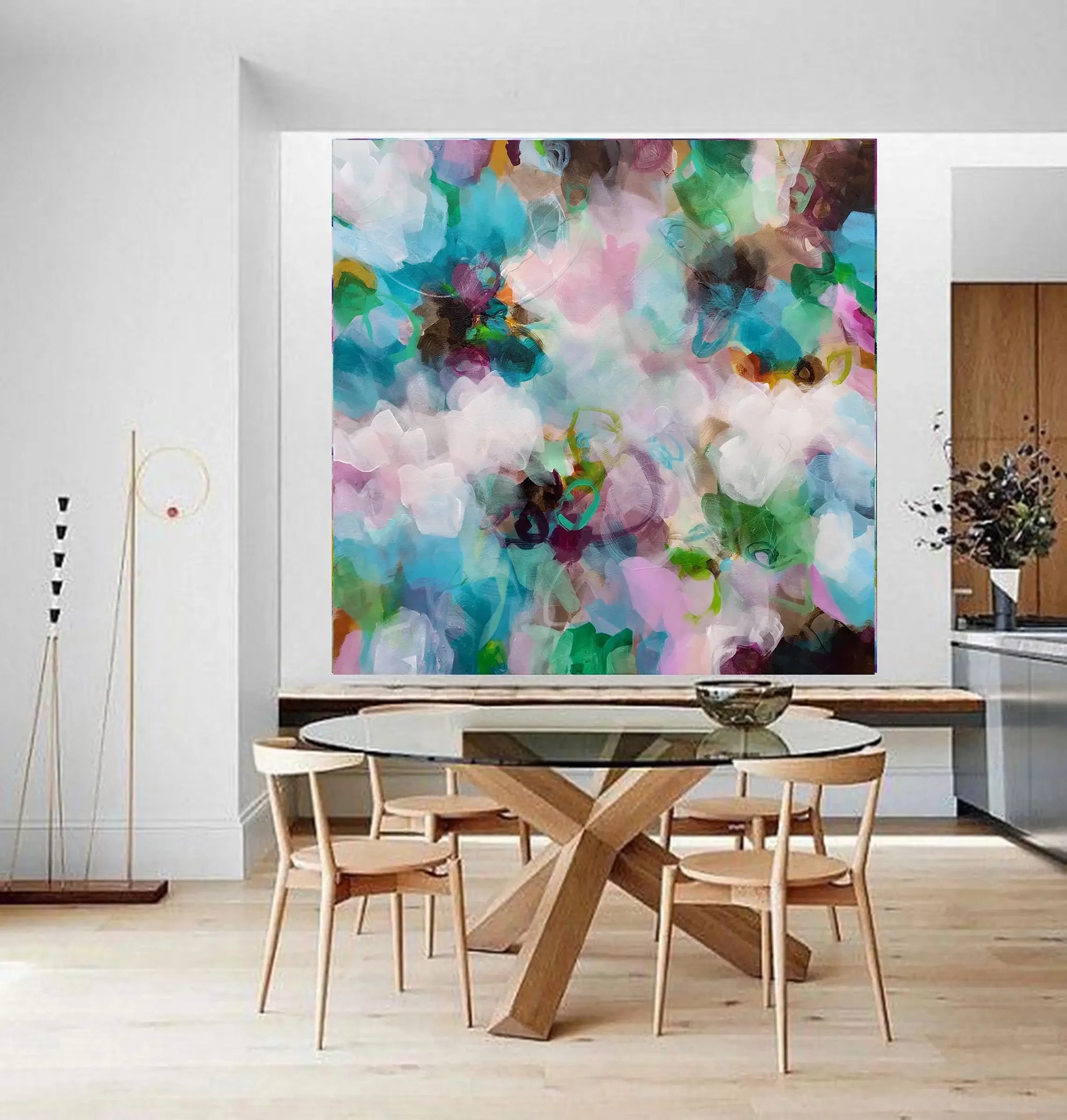 Colorful floral inspired Painting with floral patterns in various colors above dining table and chairs