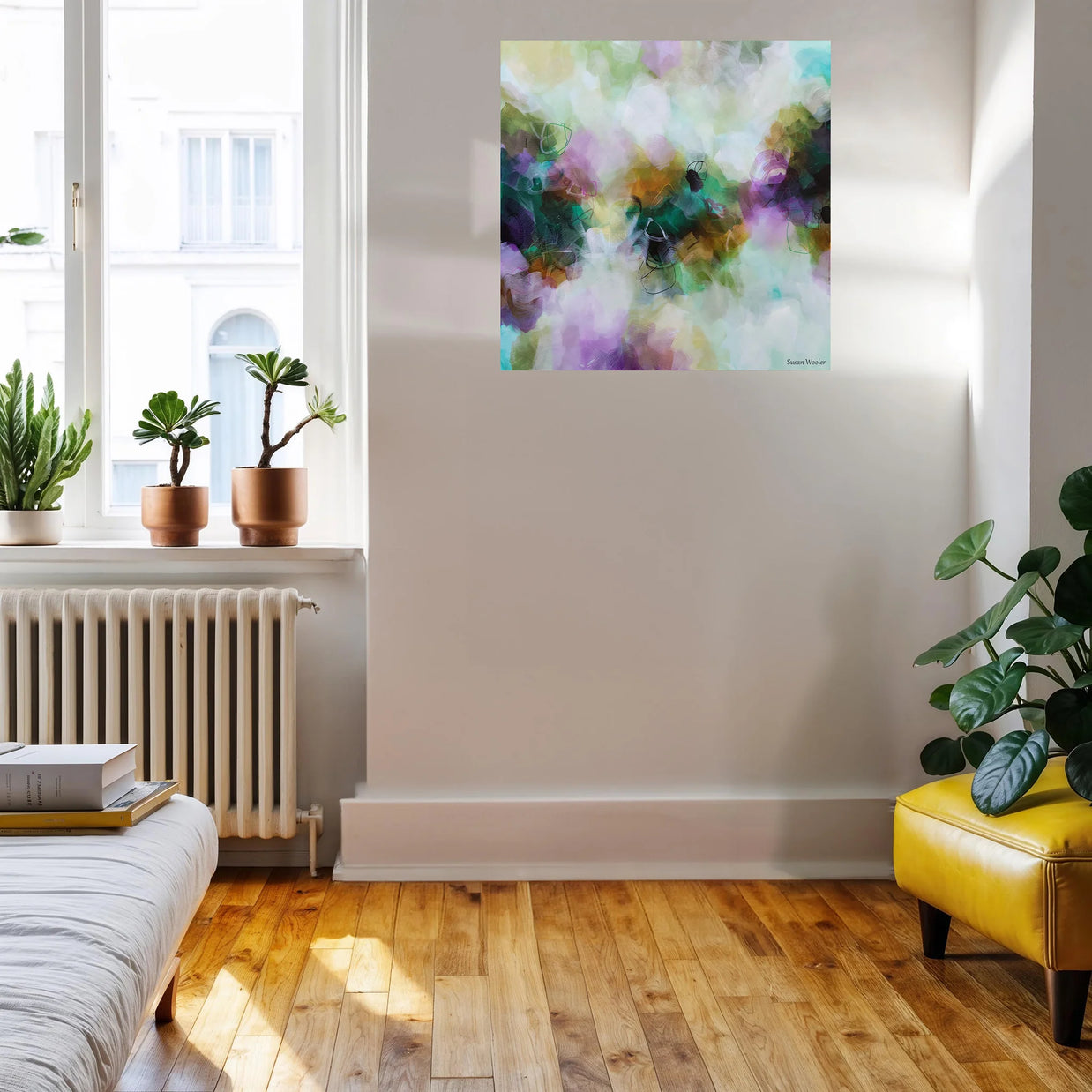 Living room with a colorful abstract painting on the wall, plants, and a yellow chair.