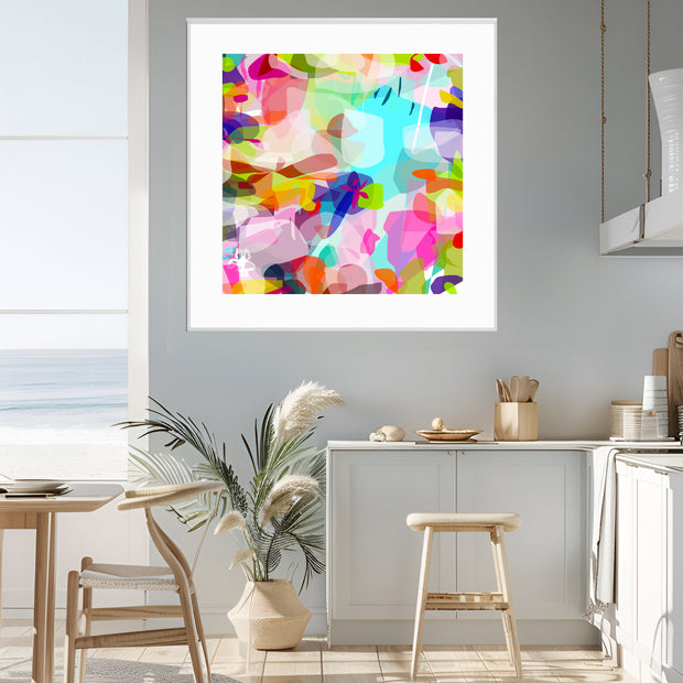 Colorful abstract art print on a wall in a modern kitchen.
